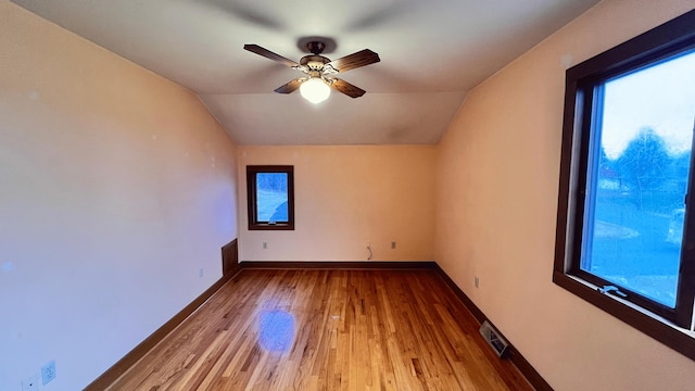 additional living space featuring ceiling fan, light wood-type flooring, and lofted ceiling