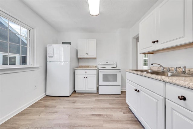 kitchen featuring white cabinetry, sink, white appliances, and light wood-type flooring