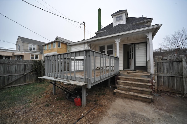 back of property featuring a deck