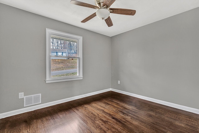 spare room with hardwood / wood-style floors and ceiling fan