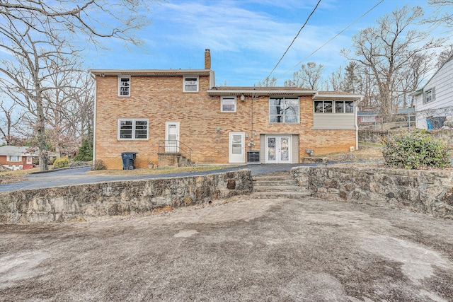 back of property featuring french doors