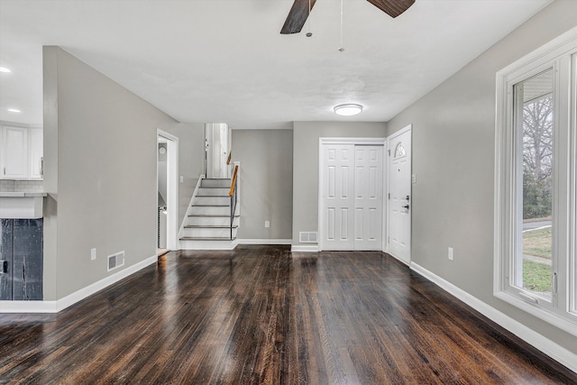 entryway featuring ceiling fan and dark hardwood / wood-style flooring