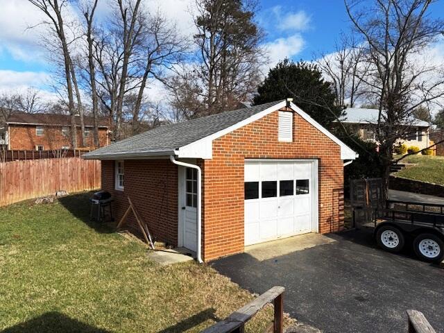 garage with a lawn