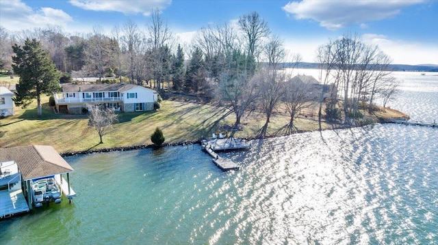 birds eye view of property featuring a water view