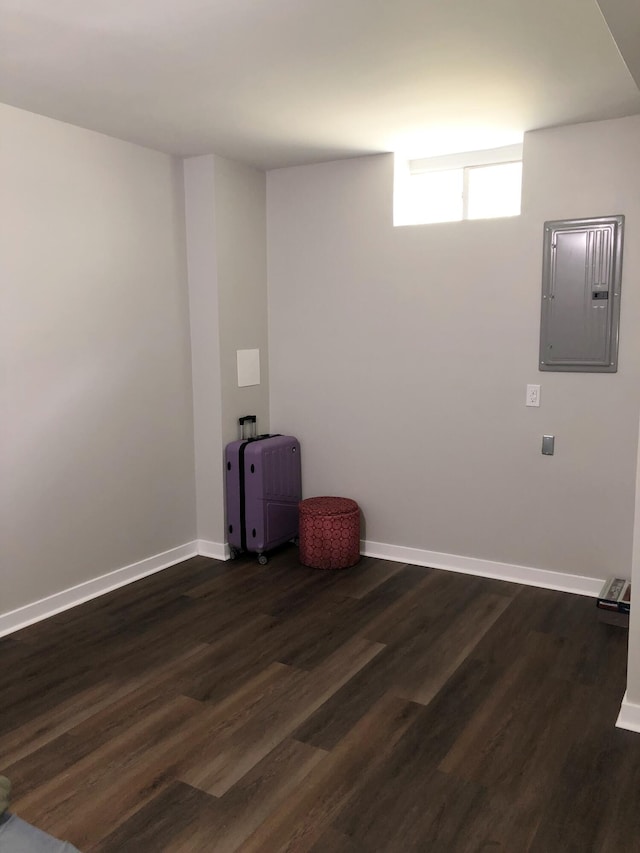 washroom with dark wood-type flooring and electric panel