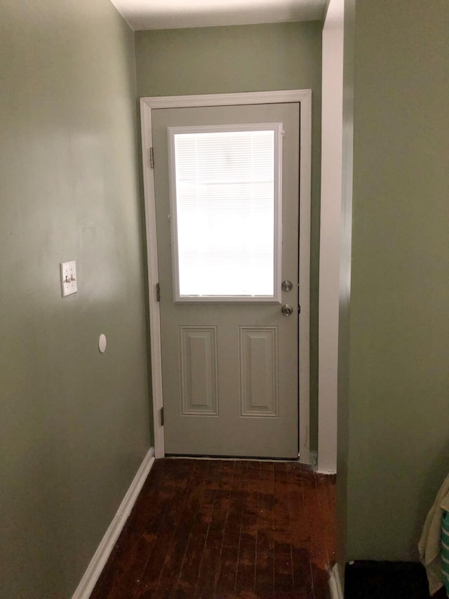 entryway with dark hardwood / wood-style flooring