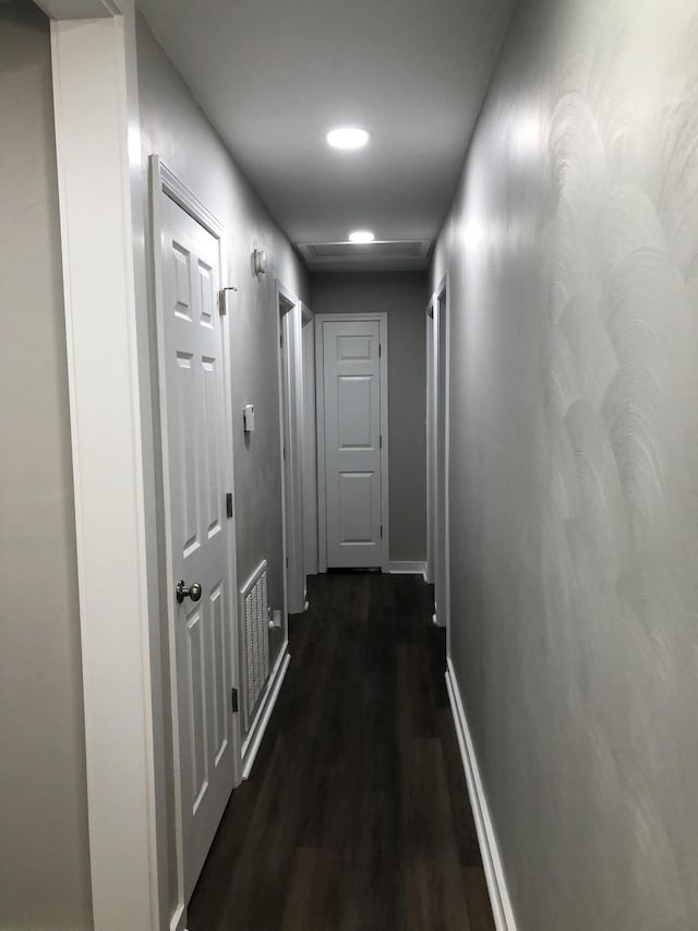 hall with dark hardwood / wood-style flooring