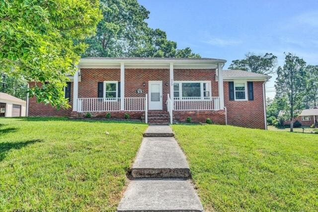 view of front of property with a front lawn and a porch