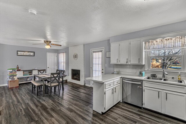 kitchen featuring dark wood-type flooring, ceiling fan, a textured ceiling, and white cabinets