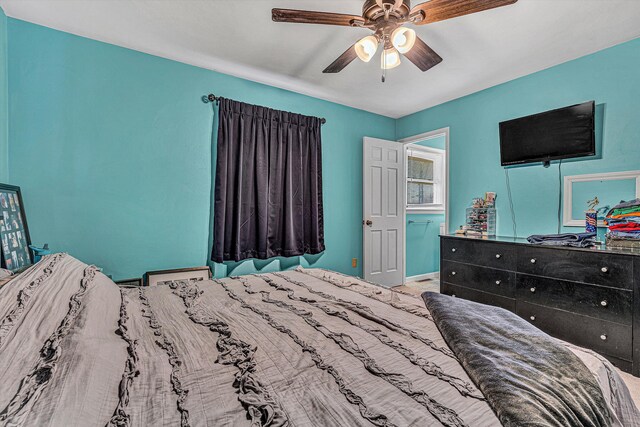 carpeted bedroom featuring ceiling fan