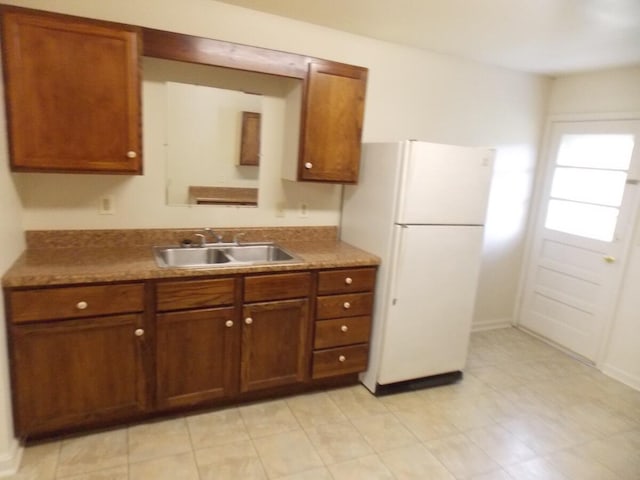 kitchen with white fridge and sink