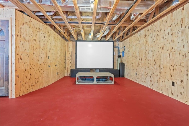 home theater featuring wood walls