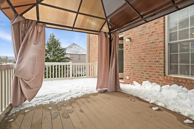 snow covered deck featuring a gazebo