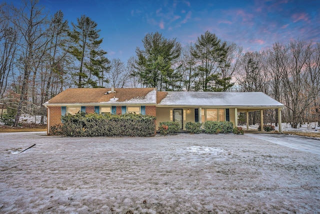 ranch-style house with a carport