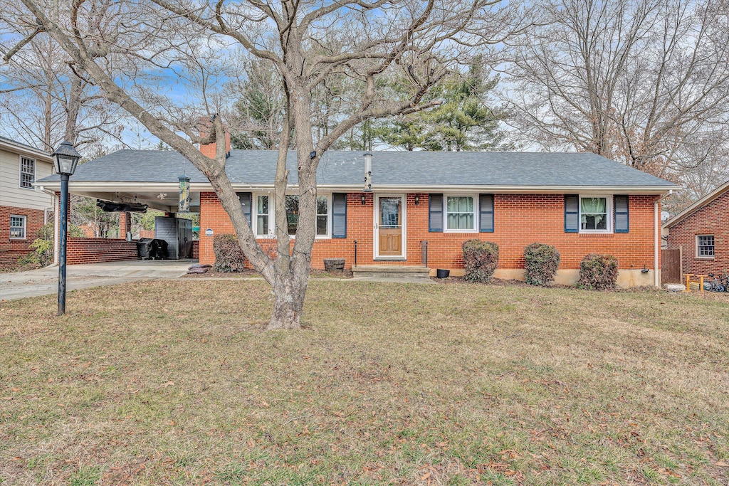 single story home featuring a front yard and a carport