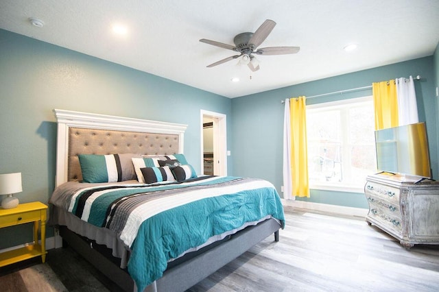 bedroom featuring hardwood / wood-style flooring and ceiling fan