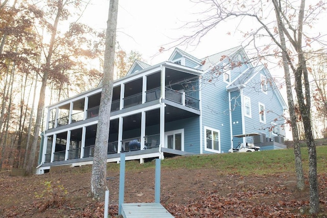 view of home's exterior featuring a balcony and central AC