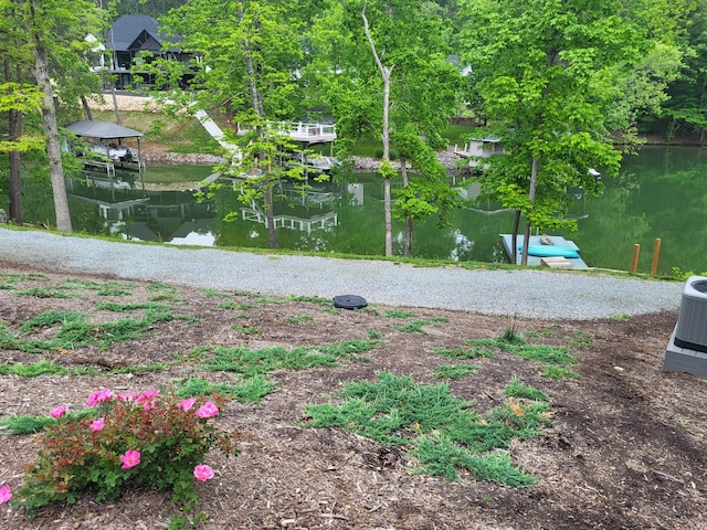 exterior space with a water view and cooling unit