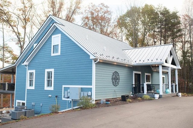 back of house featuring covered porch