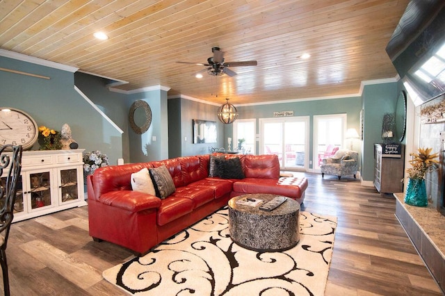 living room with hardwood / wood-style floors, wooden ceiling, ceiling fan with notable chandelier, and ornamental molding