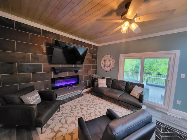 living room featuring ceiling fan, hardwood / wood-style floors, wooden ceiling, and ornamental molding