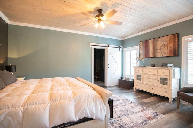 bedroom featuring a barn door, ceiling fan, wood ceiling, and ornamental molding