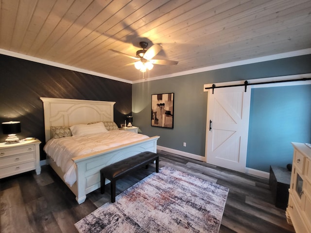 bedroom featuring ceiling fan, dark wood-type flooring, a barn door, wood walls, and ornamental molding