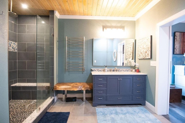 bathroom featuring tile patterned floors, wood ceiling, a tile shower, vanity, and crown molding