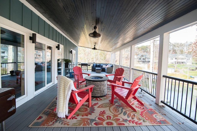 sunroom featuring wood ceiling