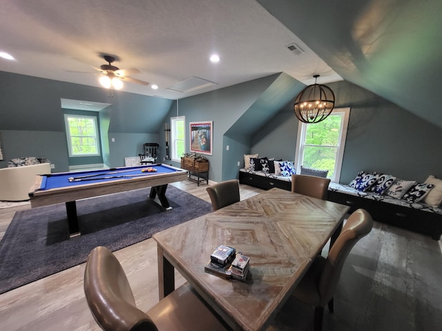 playroom featuring ceiling fan with notable chandelier, billiards, vaulted ceiling, and light wood-type flooring