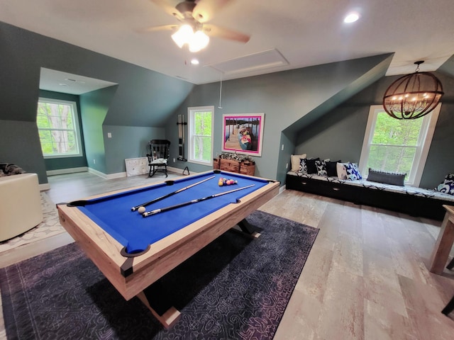 rec room featuring hardwood / wood-style floors, ceiling fan with notable chandelier, lofted ceiling, and pool table