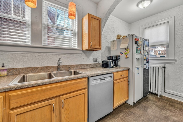 kitchen featuring sink, a wealth of natural light, radiator heating unit, and dishwasher