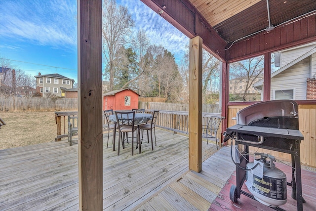 wooden terrace featuring a grill