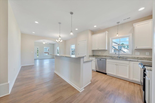 kitchen featuring appliances with stainless steel finishes, ceiling fan, sink, decorative light fixtures, and white cabinets