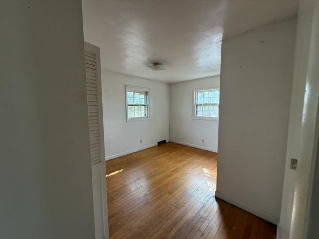 empty room with wood-type flooring