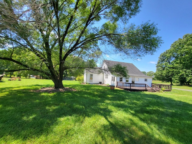 view of yard with a wooden deck