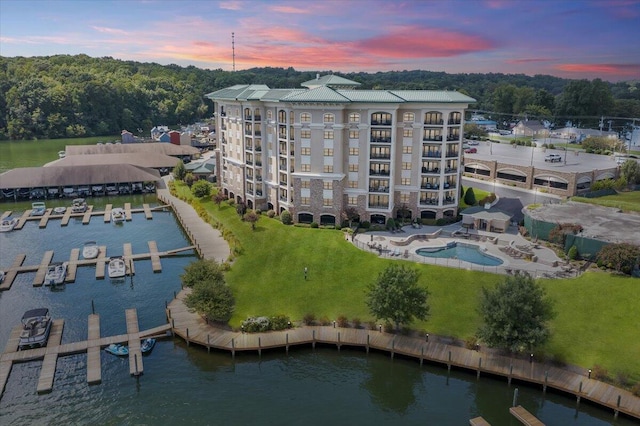 aerial view at dusk with a water view