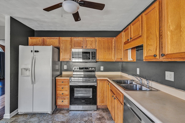 kitchen featuring ceiling fan, appliances with stainless steel finishes, and sink