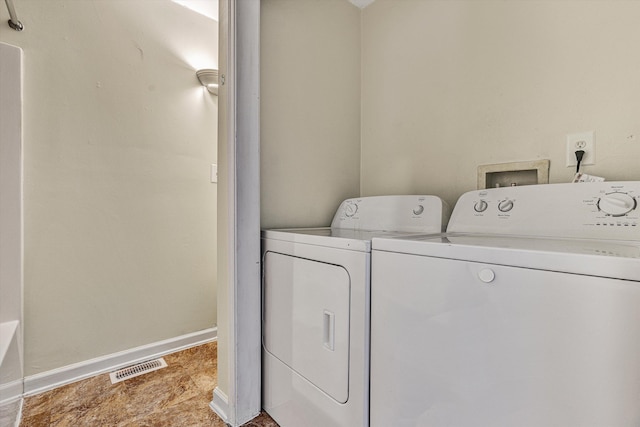 washroom featuring independent washer and dryer