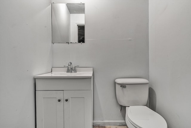 bathroom with toilet and vanity