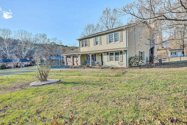 view of front facade with a front lawn and covered porch