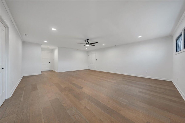 unfurnished room featuring ceiling fan and light hardwood / wood-style flooring