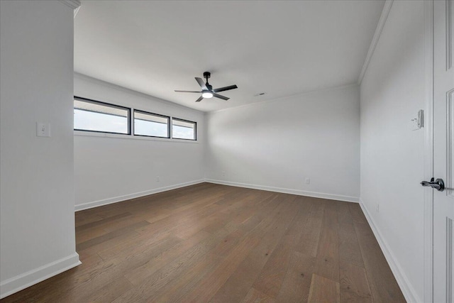 empty room with ceiling fan, ornamental molding, and hardwood / wood-style floors