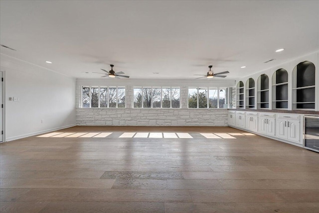 interior space featuring beverage cooler and ceiling fan