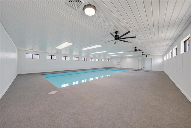 view of pool with a skylight