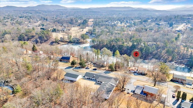 birds eye view of property with a mountain view