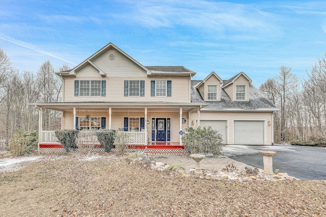 view of front of home with a porch and a garage