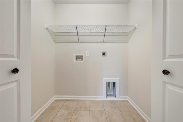 laundry room featuring washer hookup, electric dryer hookup, and light tile patterned floors