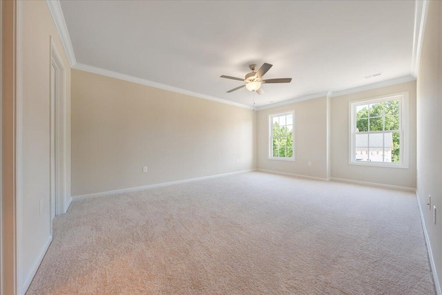 carpeted empty room featuring ceiling fan and ornamental molding