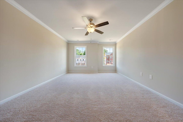 unfurnished room featuring ceiling fan, light colored carpet, and ornamental molding